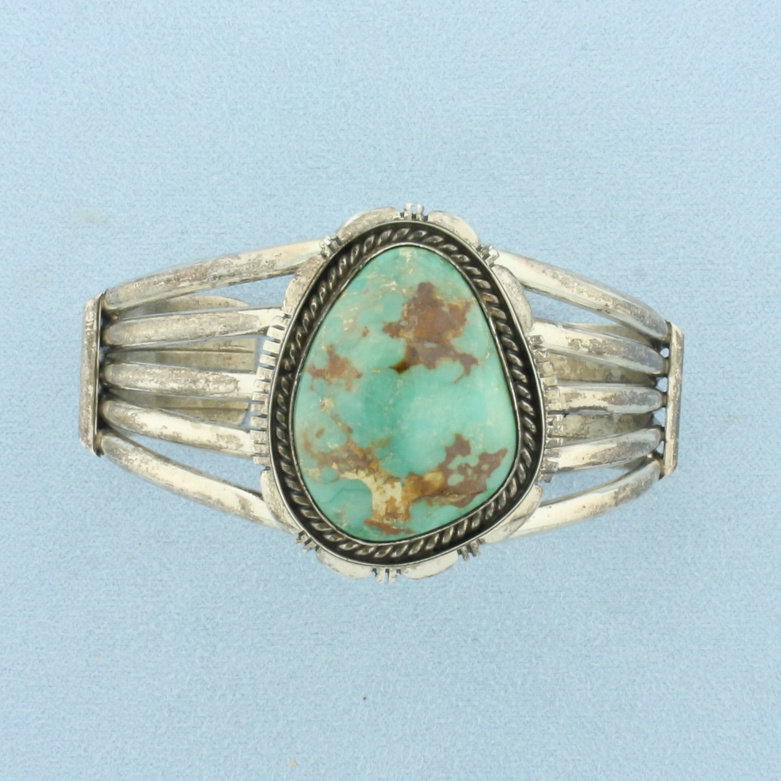 G. Spencer Signed Navajo Turquoise Cuff Bracelet in Sterling Silver: In .925 Sterling Silver. Contains one 1 1/8 inch by 3/4 inch high quality turquoise gemstone. Interior dimensions: 2 1/4 inch by 1 5/8 inch. 1 3/8 inch wide at center. 47.7g.
