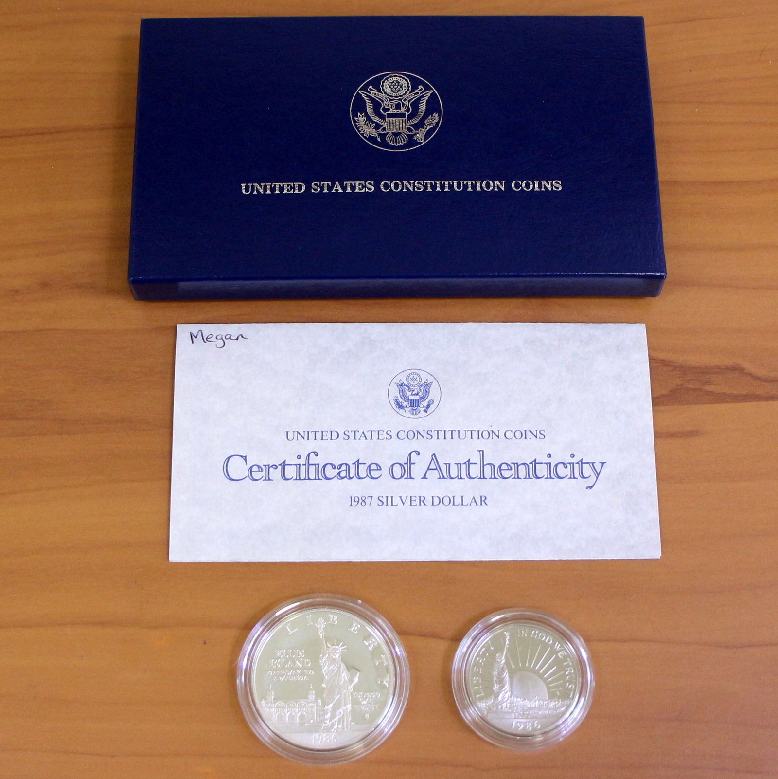 1987 US Constitution Proof Coin Set OGP: Contains one 1987 United States Constitution commemorative silver dollar. Also contains one 1987 United States Constitution half dollar. Set in original government packaging and contains certificate o