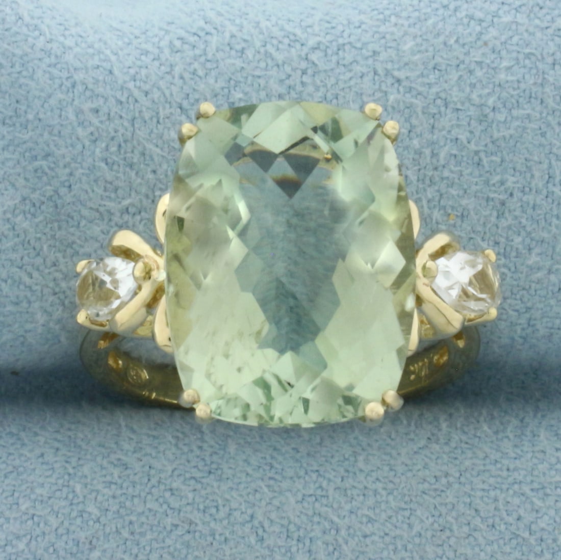 Prasiolite and White Topaz Ring in 10k Yellow Gold: In _k Yellow Gold. Contains one 16x12mm high quality checkerboard cut natural Prasiolite gemstone with bright color and excellent clarity. Also contains two 6mm high quality pear cut White Topaz gemst