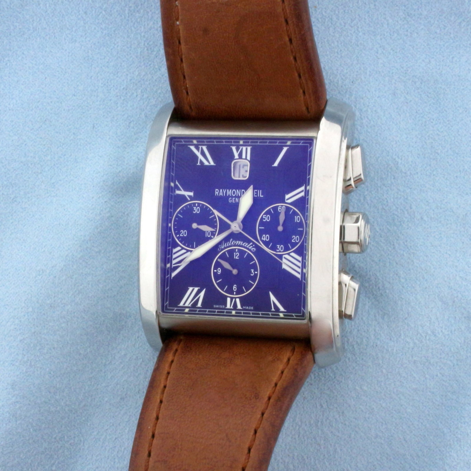 Raymond Weil Don Giovanni Model 4875 Automatic Chronograph 38mm Watch: In Stainless Steel. Overall great condition. Brown leather strap. Swiss 47 jewel automatic movement runs great. Large 38mm case. No scratching on sapphire crystal. Water resistant 3ATM. Model 4875, se