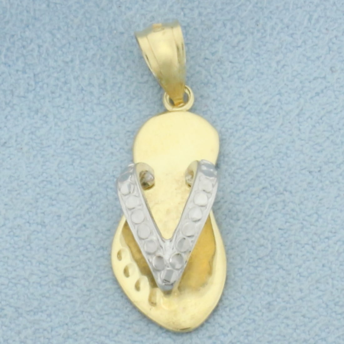 Flip Flop Sandal Pendant in 14k Yellow and White Gold: In 14k Yellow and White Gold. 1 1/8 inches long including bale. 3/8 inch wide at widest. 1.7g.