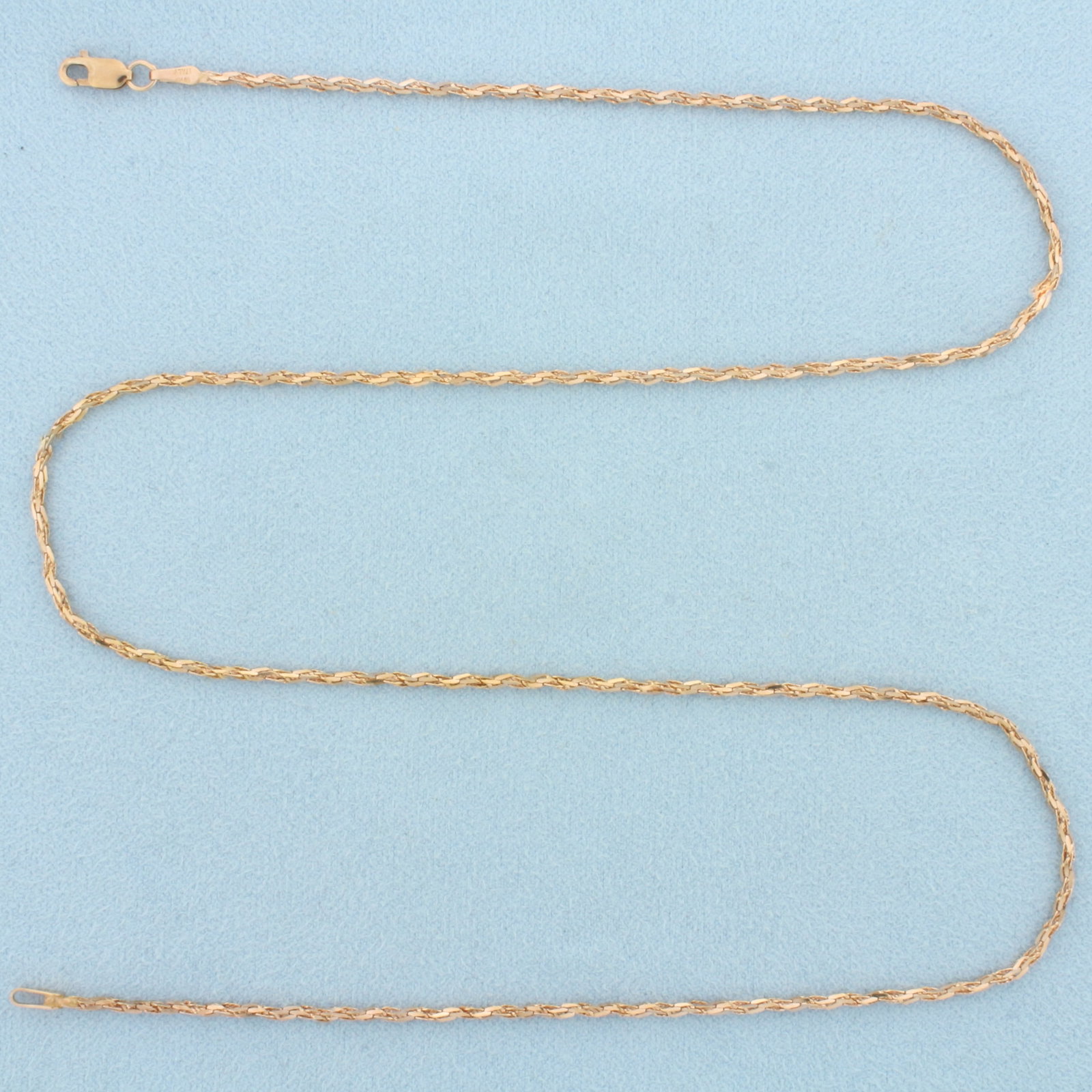 Italian 20 Inch Twisting Bevel Link Chain Necklace in 18k Rose Gold: In 18k Rose Gold. 20 inches long. 1.6mm wide. Italian made. Lobster clasp. 4.7g.