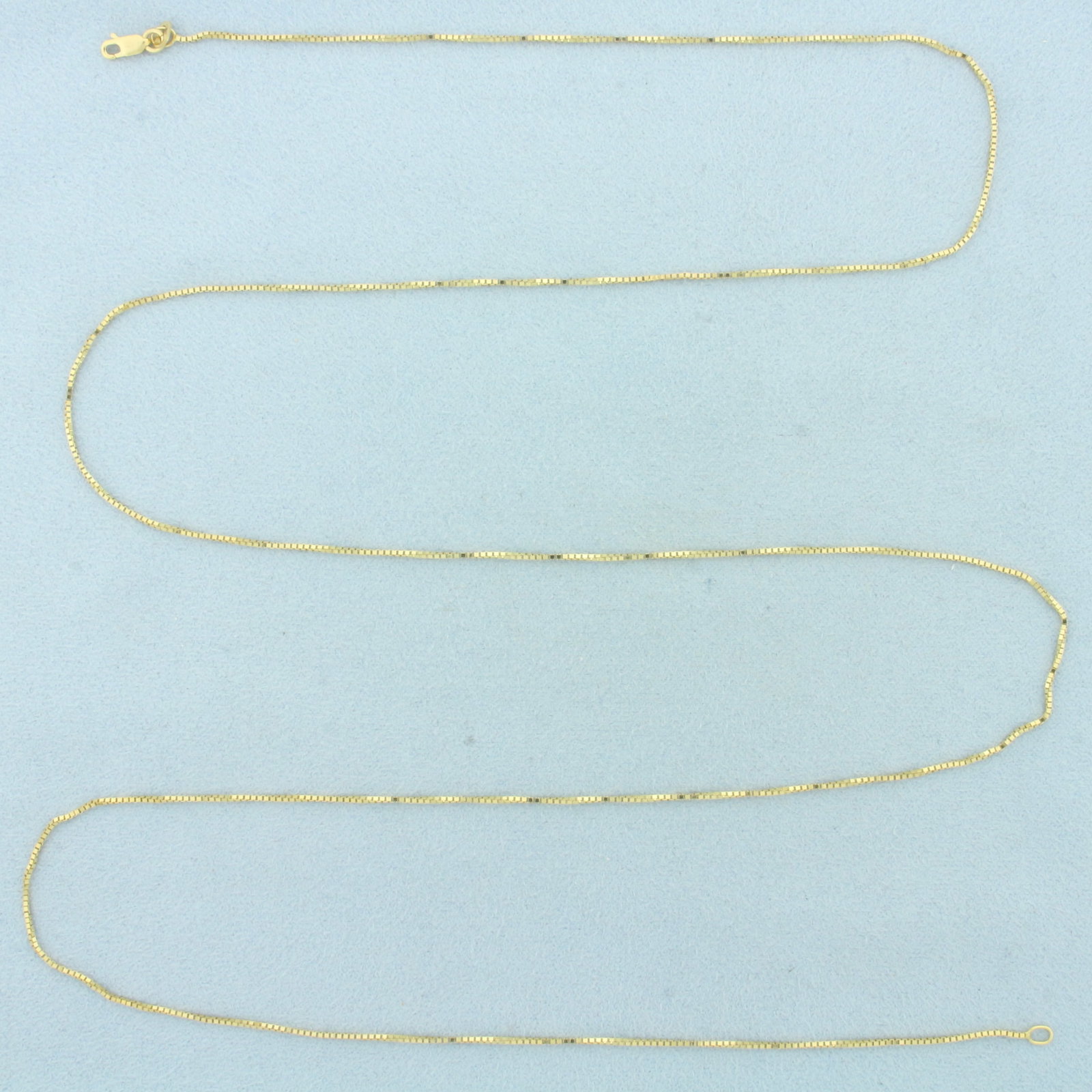 Italian 30 Inch Box Link Chain Necklace in 14k Yellow Gold: In 14k Yellow Gold. 29 inches long. 1mm wide. Box link. Made in Italy. Lobster clasp. 3.4g.