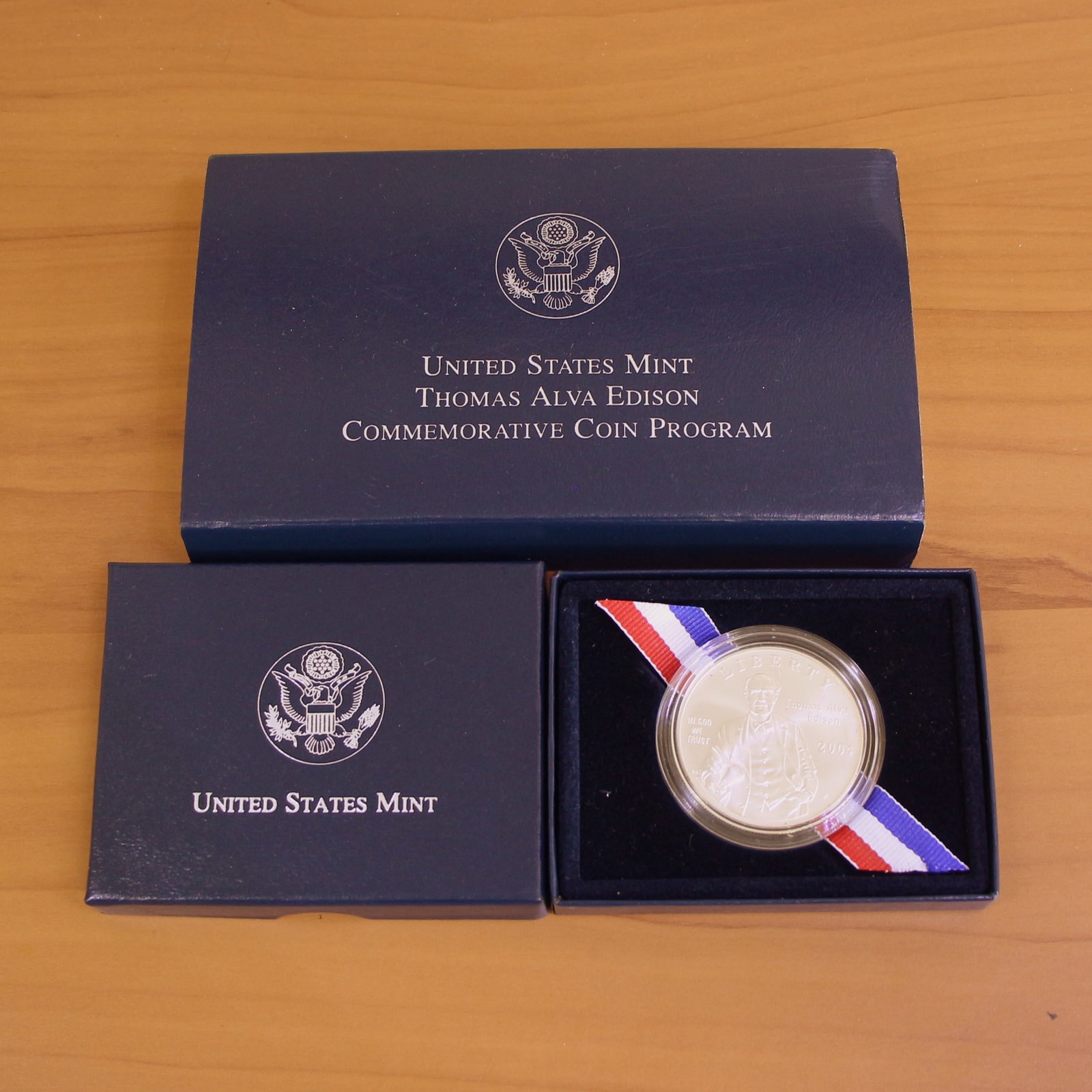 2004 US Mint Thomas Alva Edison Commemorative Silver Proof Coin OGP: Contains one 2004 United States Mint Thomas Alva Edison Commemorative Proof Coin. 90% silver. Set in original government packaging.
