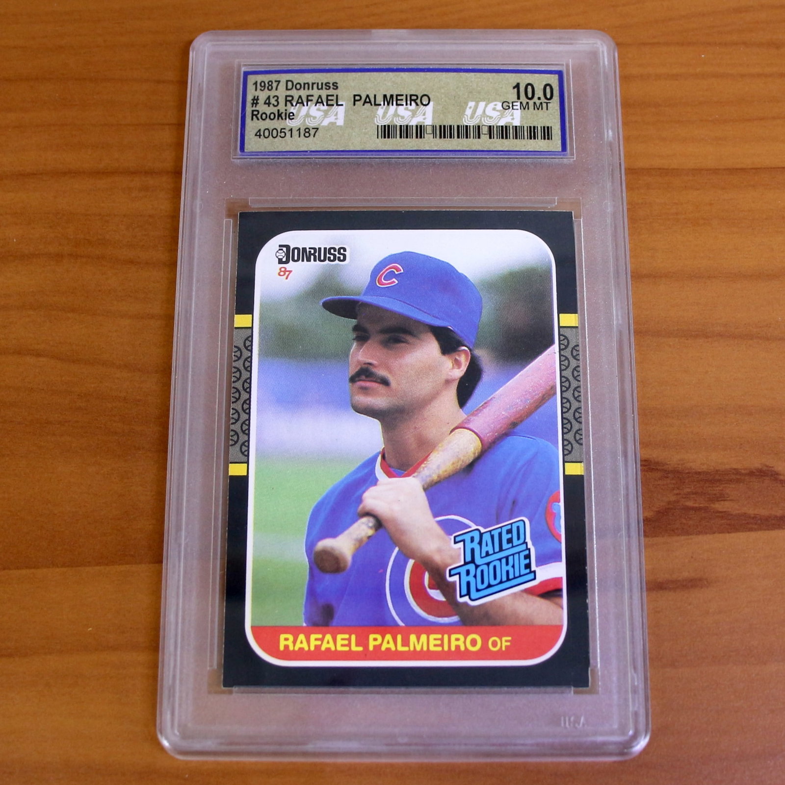1987 Donruss Baseball #43 Rafael Palmeiro Rookie Card Gem Mint: Contains one 1987 Donruss Baseball #43 Rafael Palmeiro Rookie Card. Graded Gem Mint 10. Set in protective casing.