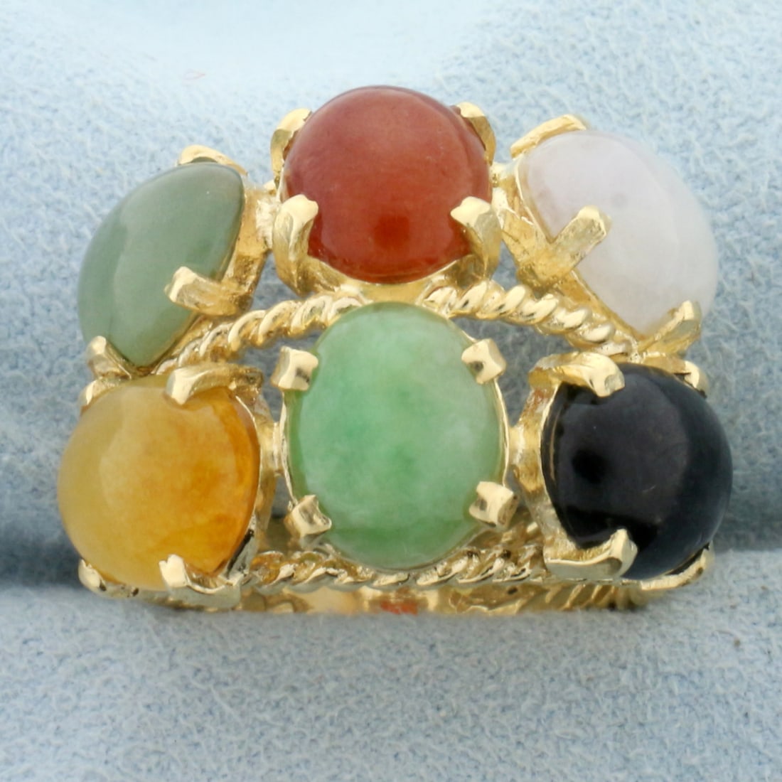 Designer Jade Statement Ring in 14K Yellow Gold: In 14K Yellow Gold. Contains six high quality natural 10x8mm oval Jade gemstones in different colors, all with vibrant color and excellent clarity. Size 8. 10.2g