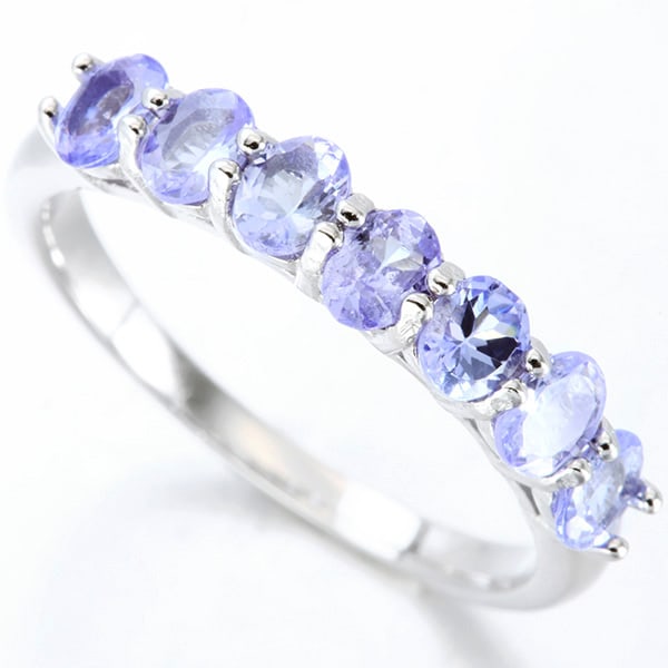 Tanzanite Stacking Band Ring in Sterling Silver: In platinum over .925 sterling silver. Contains 7 genuine tanzanite gemstones with light purple/blue color, 1.1ctw. Size 7. 2.4g