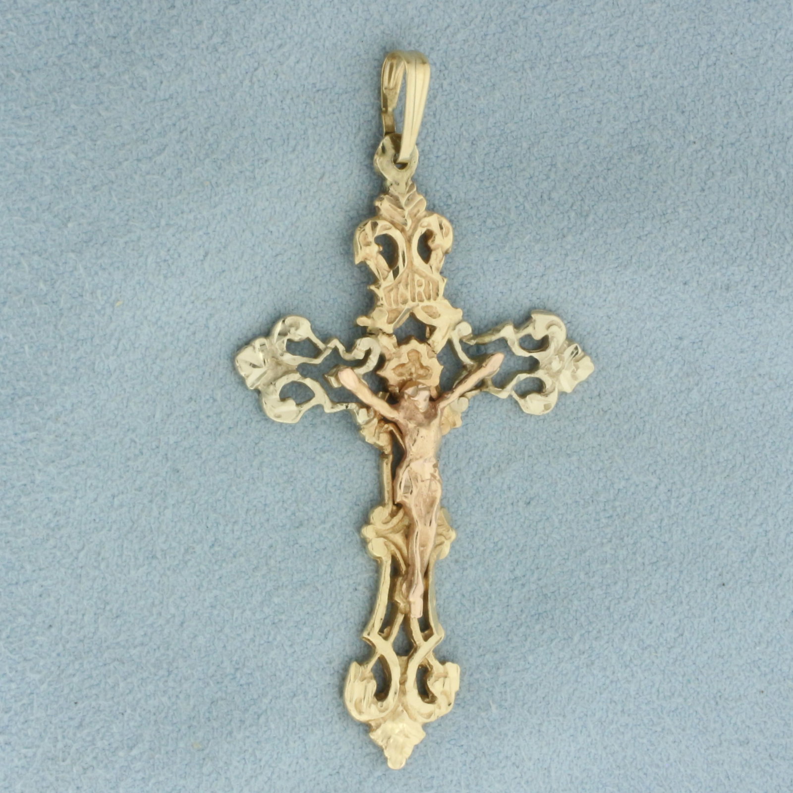 Crucifix Jesus Pendant in 14k Yellow, Rose, and White Gold: In 14k Yellow, Rose, and White Gold. 2 1/8 inches long including bale. 1 1/8 inch wide. 4.9g.