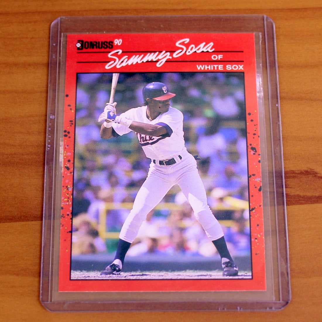 1990 Donruss Baseball #489 Sammy Sosa Rookie Card: Contains one 1990 Donruss Baseball #489 Sammy Sosa Rookie Card. Set in protective sleeve.