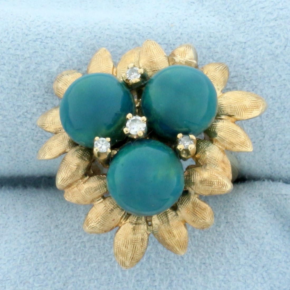 Jade And Diamond Flower Ring In 14k Yellow Gold: 14k Yellow Gold. Contains three high quality natural 8.25mm Jade gemstone beads with intense aqua green color. Also contains four diamonds, .1ct TW, ,SI clarity/H color. Size 5.5. 11.0g.