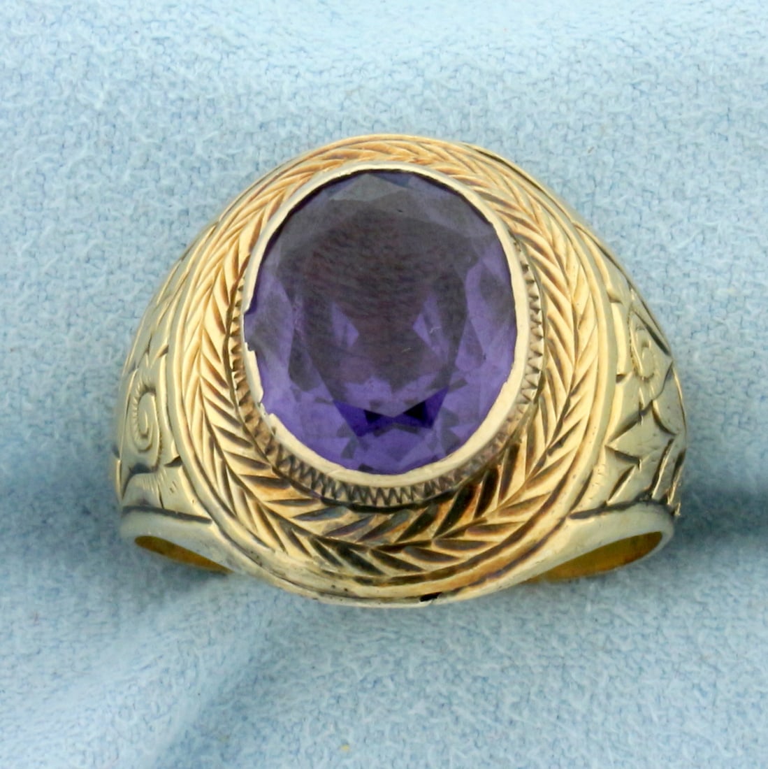 Antique Victorian Purple Sapphire Ring in 18k Yellow Gold: In 18k yellow gold. Contains a 4ct high quality natural purple Sapphire with intense purple color and excellent clarity, bezel set. Detailed metalwork includes leaves and scrollwork. Size 10 1/2. 8.6g