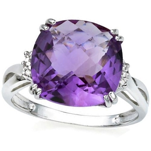 Cushion Cut Amethyst and Diamond Ring in Sterling Silver: In platinum over .925 sterling silver. Contains one cushion cut amethyst gemstone, 3.8cts, excellent color and clarity, accented with 2 genuine diamonds, .01ctw. Size 8. 3.1g