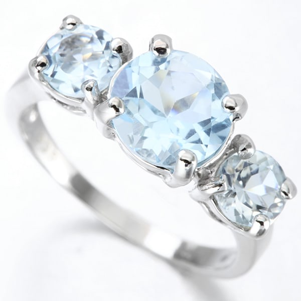 Sky Blue Topaz 3-Stone Ring in Sterling Silver: In platinum over .925 sterling silver. Contains one 2.2ct sky blue topaz and two 0.55ct sky blue topaz gemstones. Total gemstone weight is 3.3ctw. Size 7. 4.0g