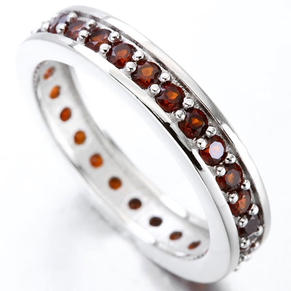 Garnet Eternity Stacking Band Ring in Sterling Silver: In platinum over .925 sterling silver. Contains 28 genuine garnet gemstones, 1.2ctw. Size 7. 3.5g