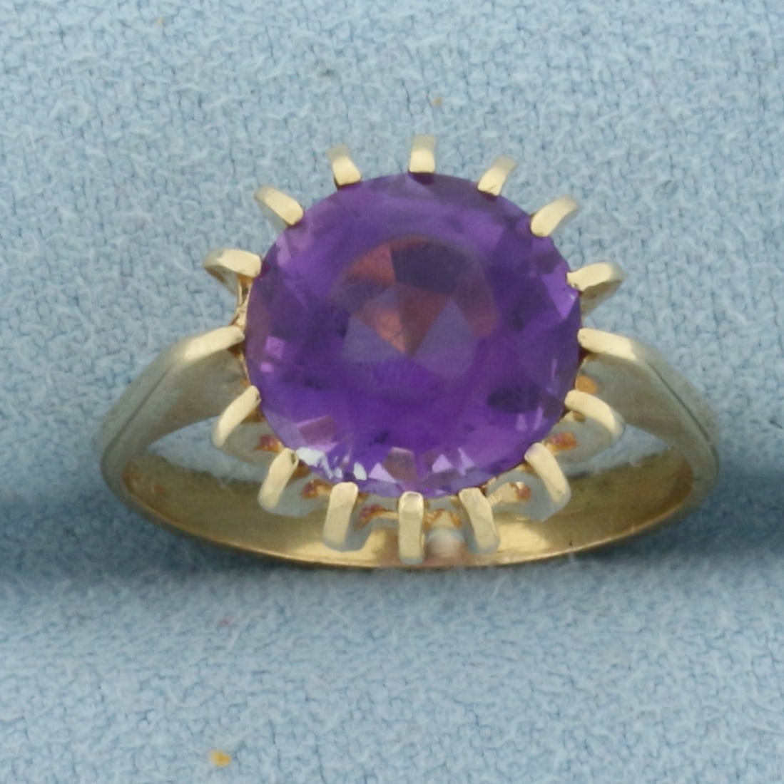 Vintage Amethyst Ring in 10k Yellow Gold: In 10k Yellow Gold. Contains one 10mm high quality natural Amethyst gemstone with vibrant color and excellent clarity. Some abrasion on stone, indicative of age, does not take away from beauty of ring