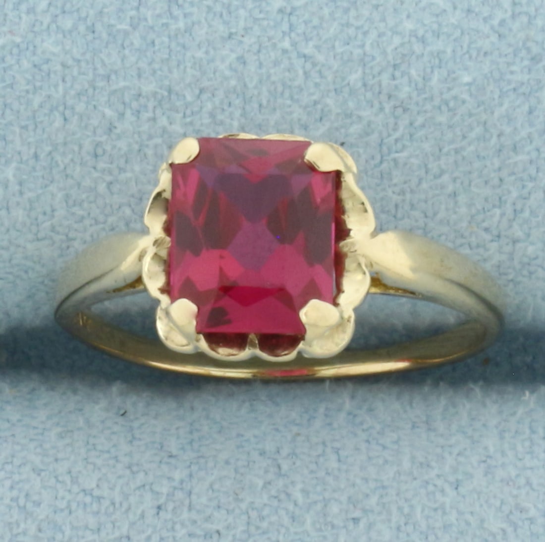 Vintage Lab Ruby Ring in 10k Yellow Gold: In 10k Yellow Gold. Contains one 8x6.5mm high quality Lab Ruby gemstone with intense color and excellent clarity. Size 7.5. 1.8g.