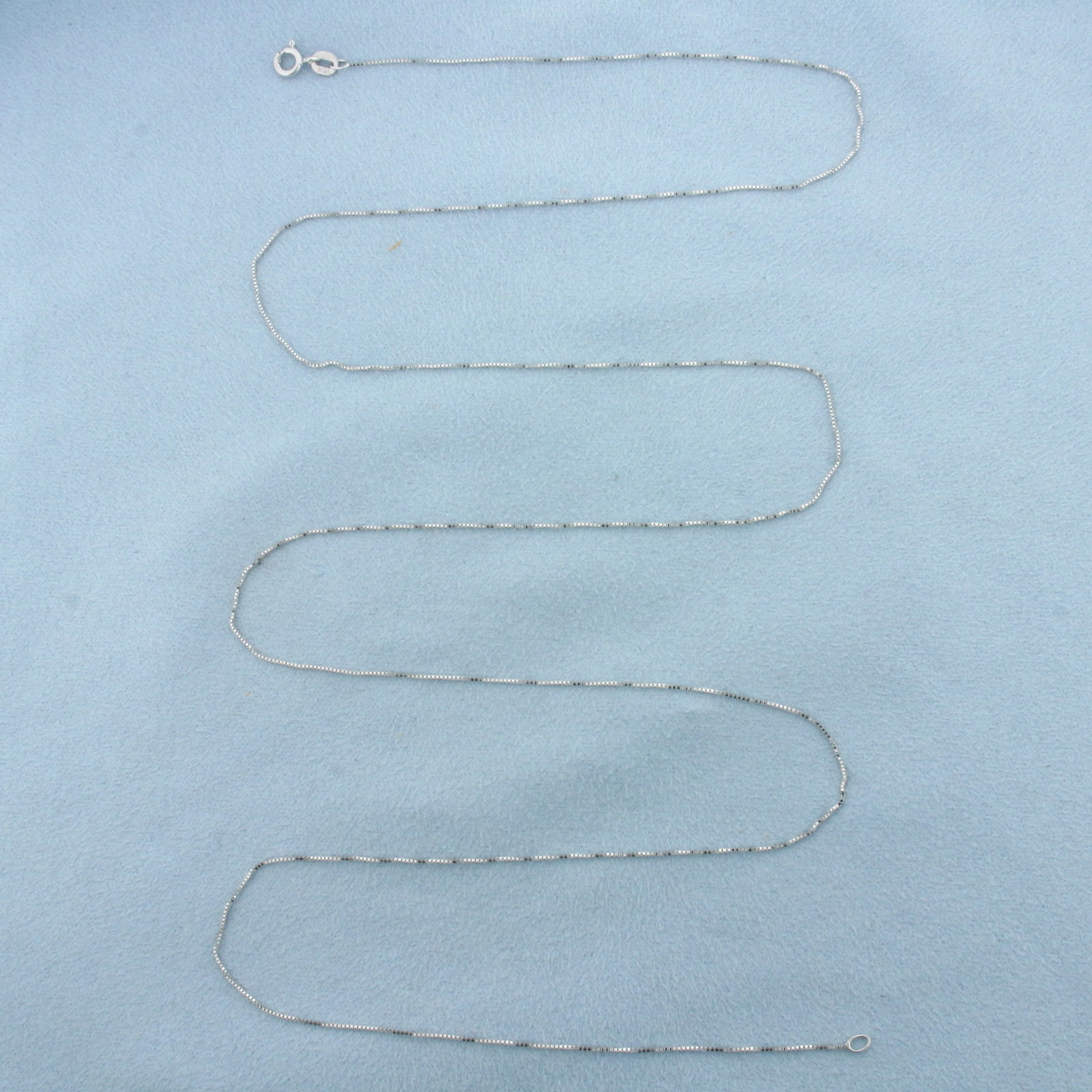 30 Inch Italian Box Link Chain Necklace in 10k White Gold: In 10k White Gold. 30 inches long. 0.7mm wide. Italian made. Spring clasp. 1.4g.