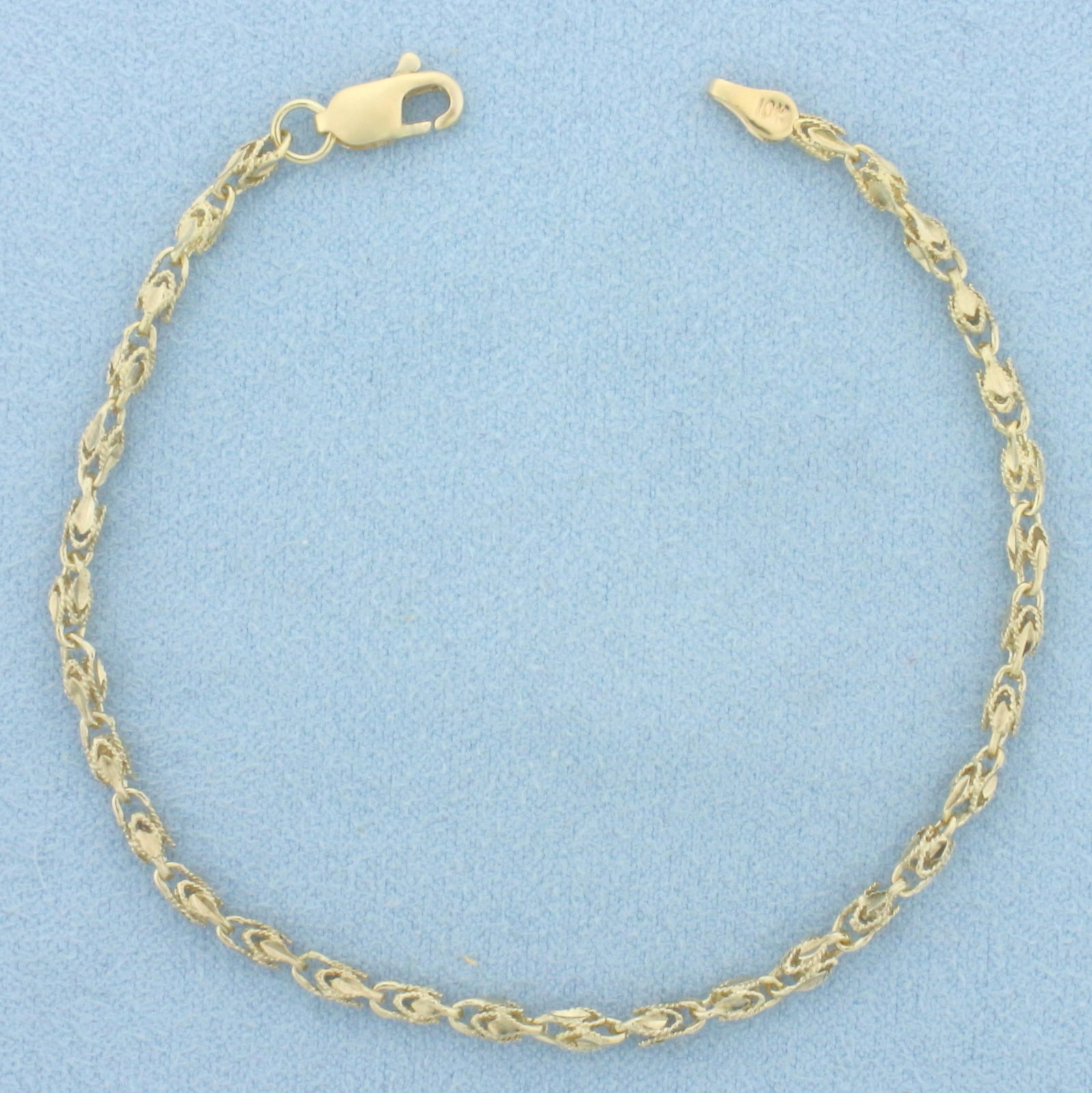 Turkish Rope Link Bracelet in 10k Yellow Gold: In 10k Yellow Gold. 7 1/8 inches long. 2.8mm wide. Lobster clasp. 2.9g.