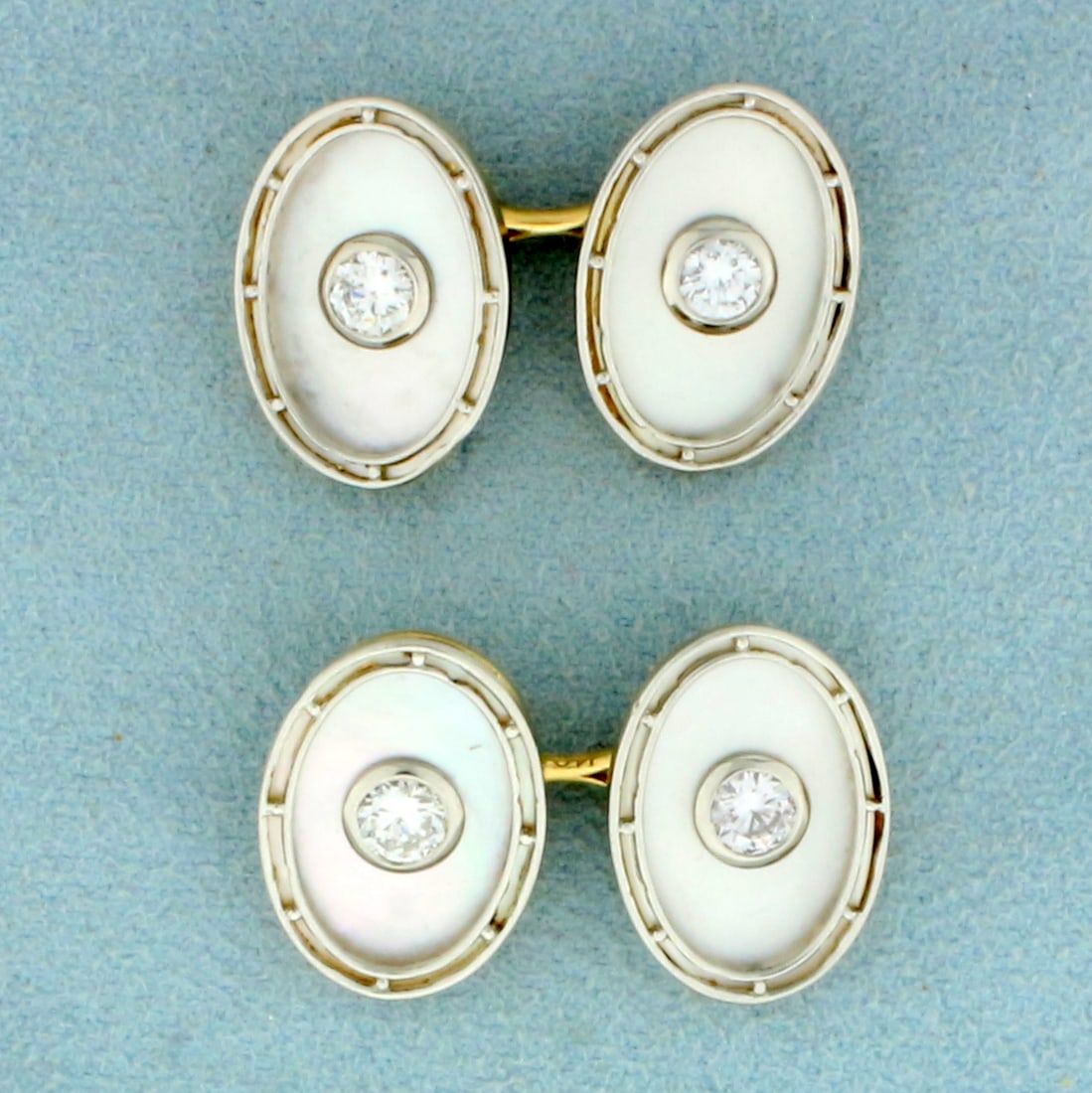 Vintage Diamond and Mother of Pearl French Cufflinks in 14K Yellow and White Gold: In 14K Yellow and White Gold. Each cufflink contains two high quality 1/4ct Diamonds, VS clarity/F color. Face of cufflink is 3/4 inches x 1/2 inch. 9.8g