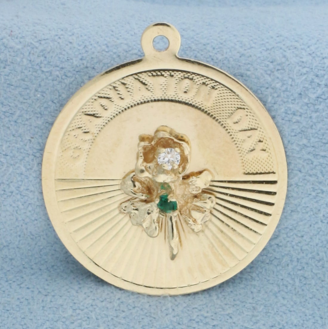 Engravable Graduation Day Diamond and Emerald Charm in 14k Yellow Gold: In 14k Yellow Gold. Contains one high quality 1.75mm emerald and one .02ct diamond. 1 inch long. 7/8 inch wide. Can engrave name and/or date on back. 2.3g.