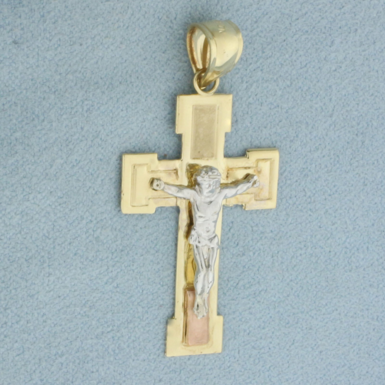 Crucifix Cross Pendant in 14k Yellow, Rose, and White Gold: In 14k Yellow, Rose and White Gold. 1 1/2 inch long including bail. 3/4 inch wide. 2.4g.