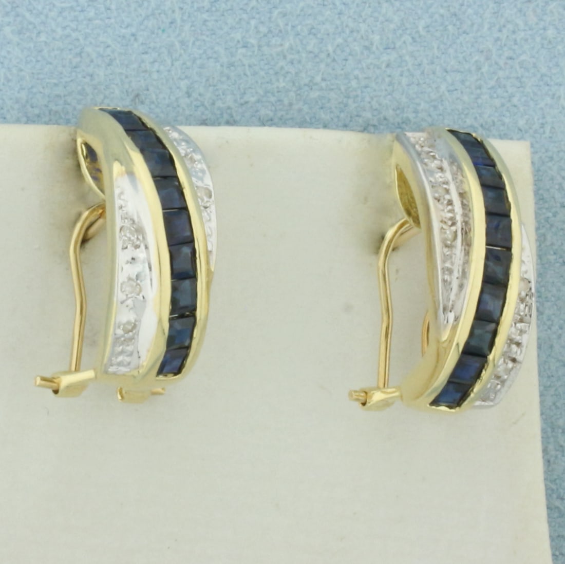 Sapphire and Diamond Half Hoop Earrings in 14k Yellow Gold: In 14k Yellow Gold. Contains twenty 2.5mm high quality square cut natural Sapphire gemstones, approximately 2ct TW, with intense color and excellent clarity. Also contains twelve high quality 1/2pt di