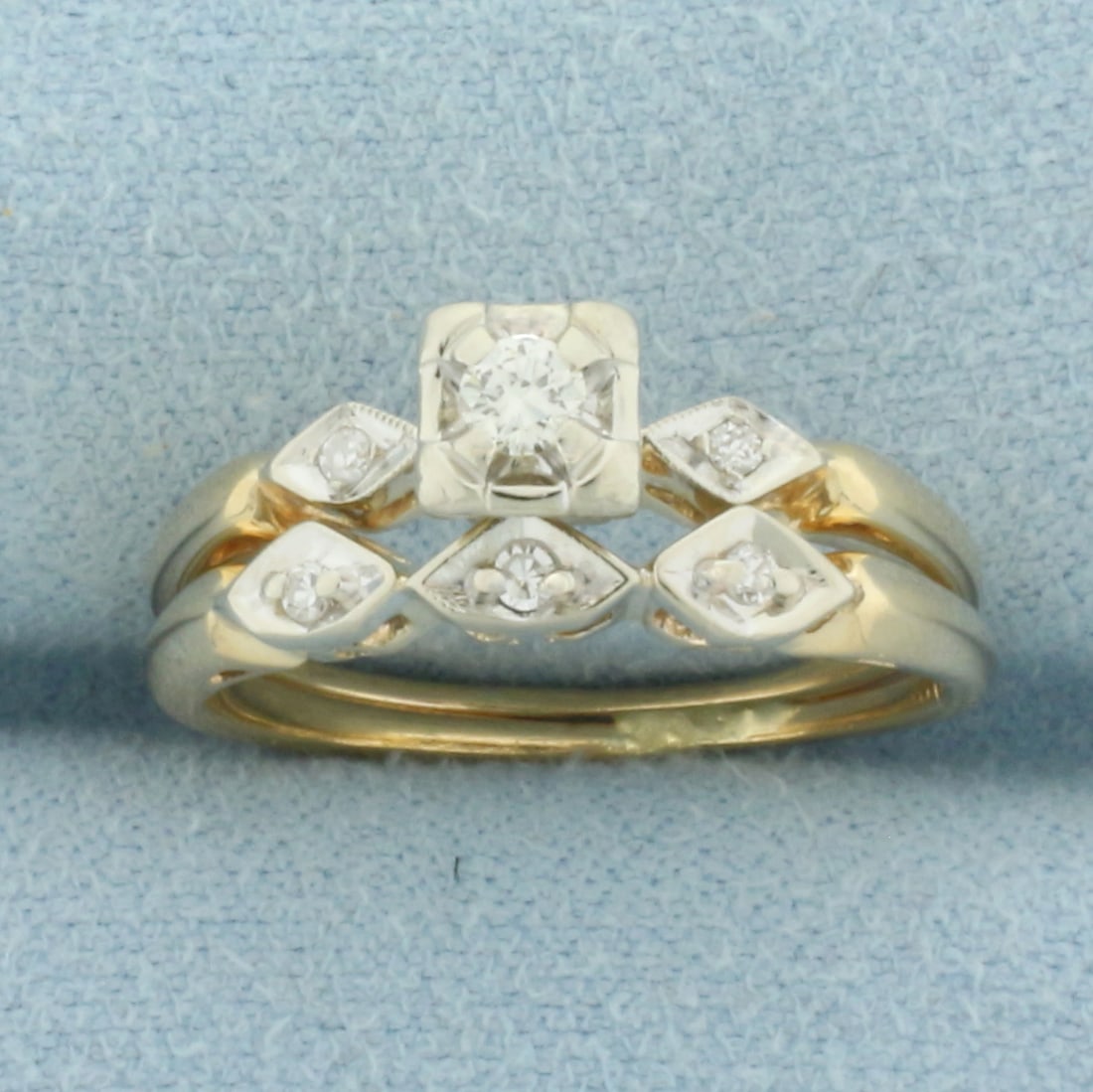 Vintage Diamond Engagement and Wedding Band Ring Bridal Set in 14k Yellow Gold: In 14k Yellow Gold. Contains one .07ct round brilliant diamonds, VS clarity/H color. Also contains five high quality 1/2pt diamonds of similar high quality. Rings are soldered together. Size 5.5. 2.6g
