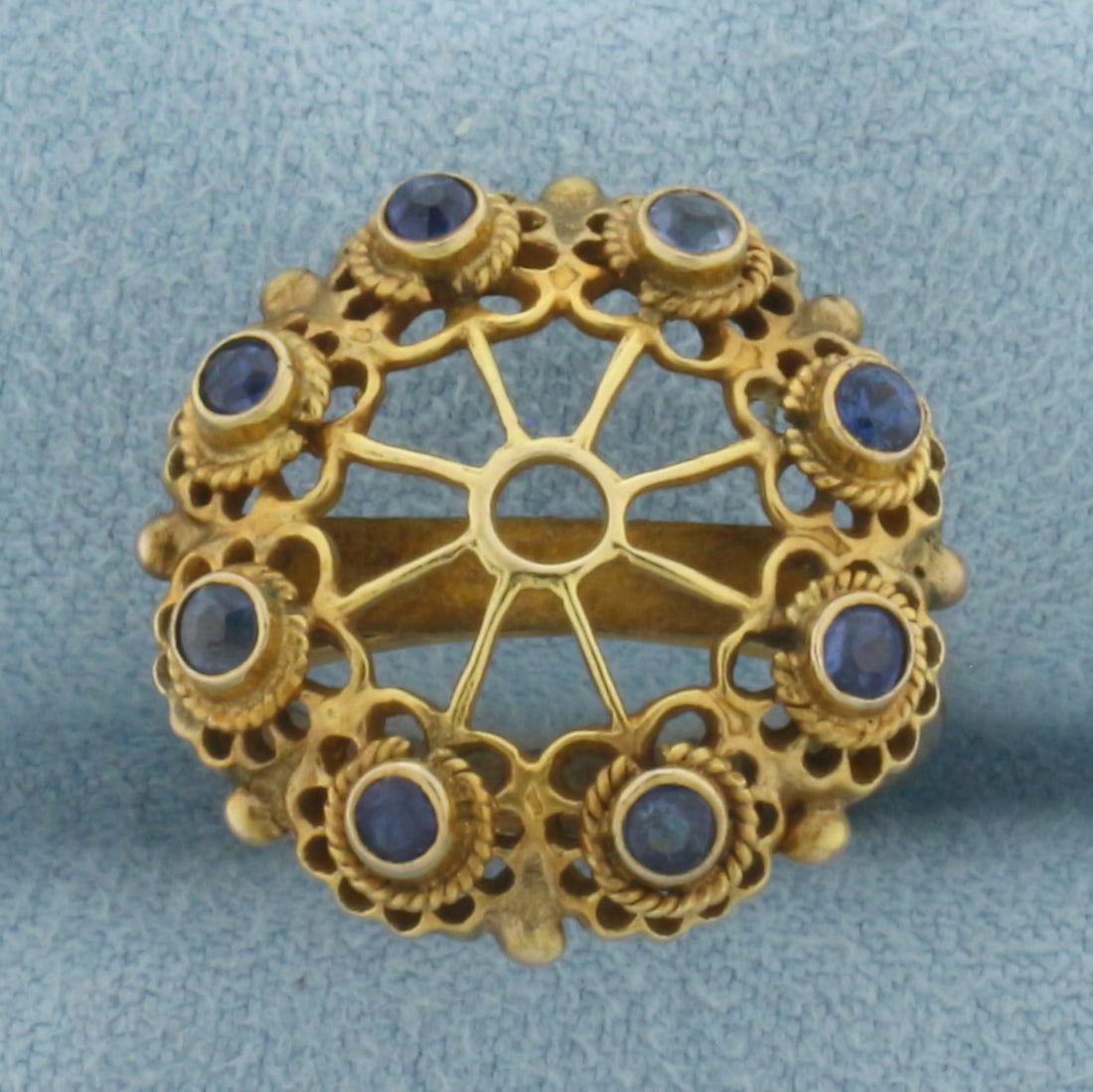 Antique Sapphire Ring in 14K Yellow Gold: In 14k yellow gold. Measures 19mm wide at top center of ring. Contains 8 high quality 2mm natural Sapphire gemstones with bright color and excellent clarity. Size 6. 4.7g.