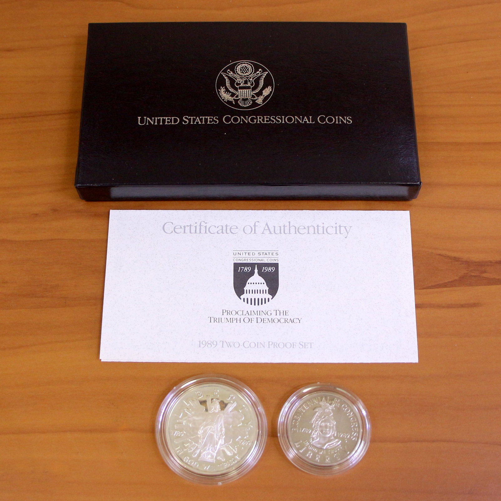 1989 US Congressional Proof Coin Set OGP: Contains one 1989 silver dollar proof. Also contains one 1989 half dollar. Set in original government packaging and contains certificate of authenticity.