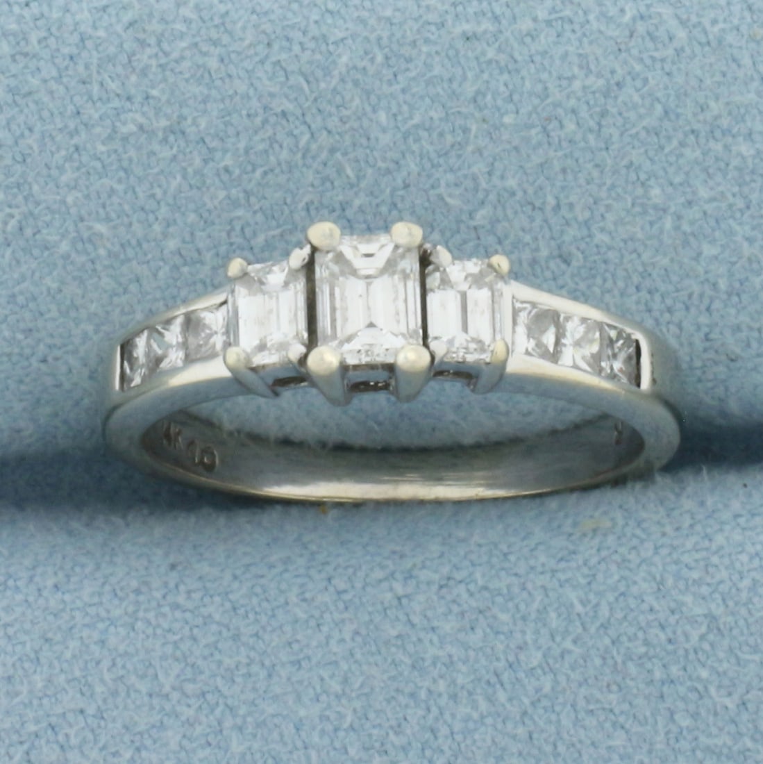 Emerald Diamond Engagement Wedding Ring in 14k White Gold: In 14k Yellow Gold. Contains one 1/3ct and two 1/5ct high quality emerald cut diamonds and six 1/10 high quality princess cut diamonds, SI clarity/G color. Size 8. 3.9g.