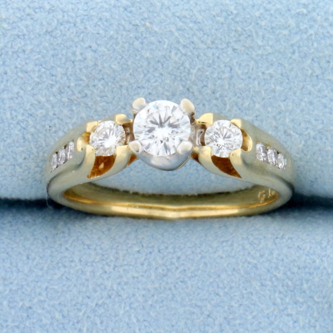Vintage Three Stone Diamond Engagement Ring in 14K White and Yellow Gold: In 14K White and Yellow Gold. Contains one high quality 1/3ct, two .1ct and six .02ct Diamonds, all high quality VS clarity/F color, great cut for added brilliance . Size 7 1/4. 5.1g