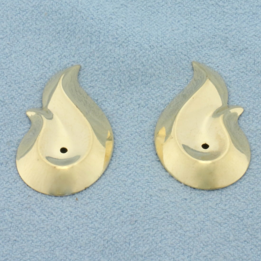 Swoop Teardrop Stud Earring Enhancers in 14k Yellow Gold: In _k Yellow Gold. 7/8 inch long. 1/2 inch wide. Made to go around diamond stud earrings to give a new look. 1.0g.