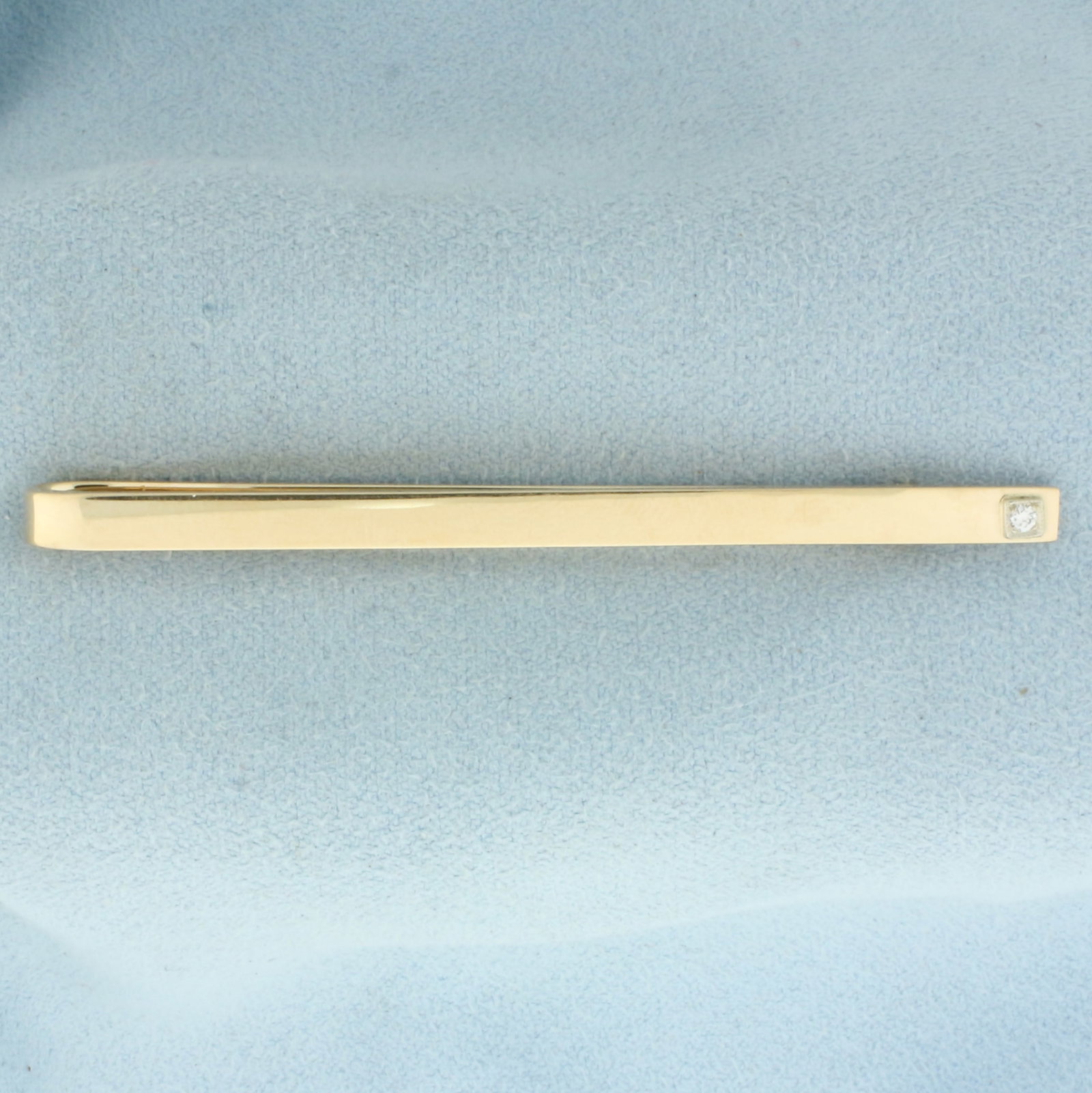 Vintage Diamond Tie Bar Clip in 14k Yellow Gold: In 14k Yellow Gold. Contains one .02ct high quality diamond, VS clarity/H color. 2.5 inches long. 1/8 inch wide. 6.9g.
