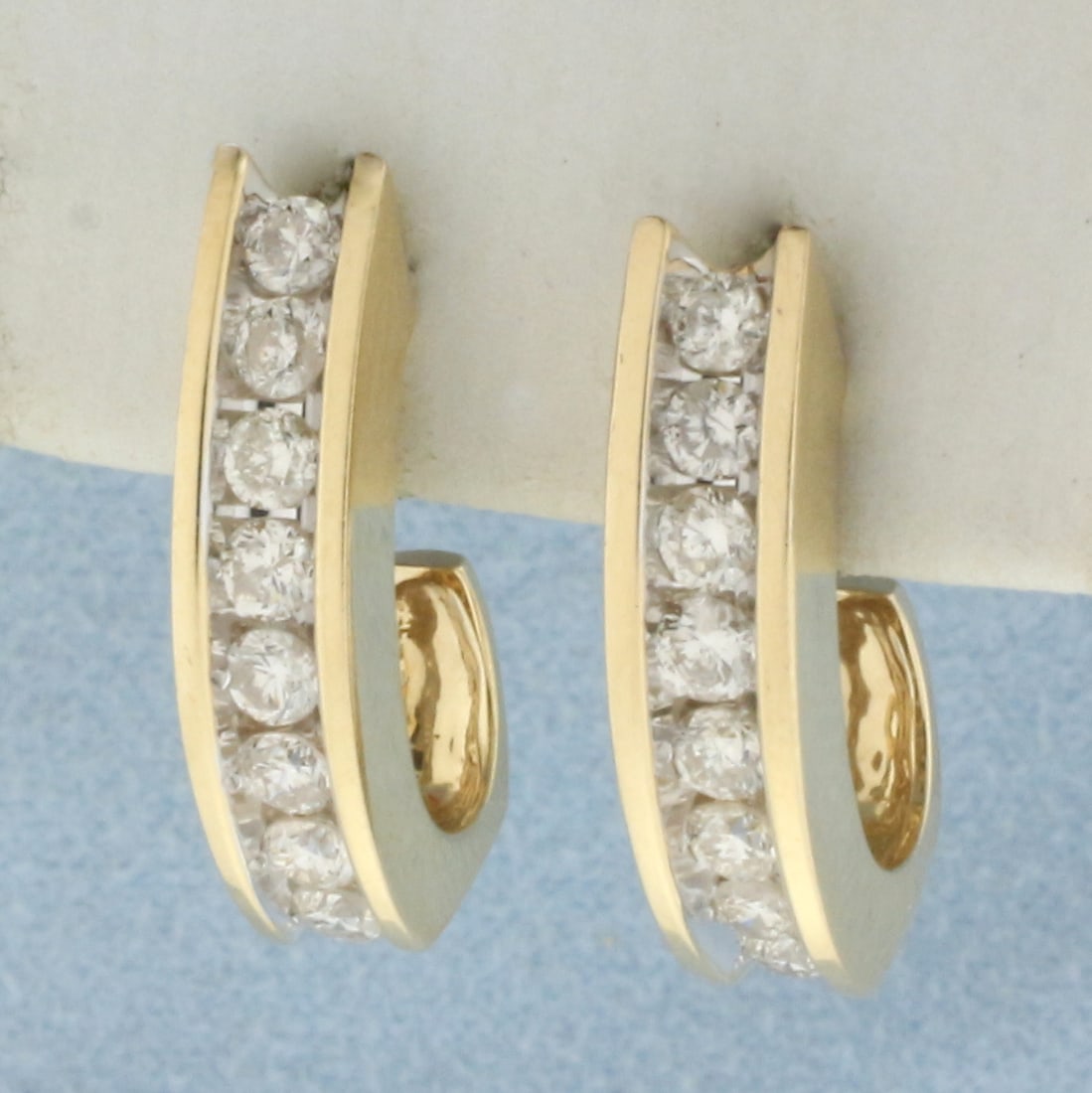 2ct TW J Hook Hoop Earrings in 14k Yellow Gold: In 14k yellow gold. Contains sixteen high quality diamonds, 2ct TW, SI clarity/H color. 3/4 inches long and 3/8 inches wide. Friction backs. 6.0g.