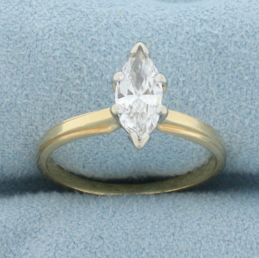 Marquise Diamond Solitaire Engagement Ring in 14k Yellow Gold: In 14k Yellow Gold. Contains one high quality 11.4 x 4.7mm 1.1ct Marquise shaped diamond, SI clarity/H color, eye clean. Size 7.5.