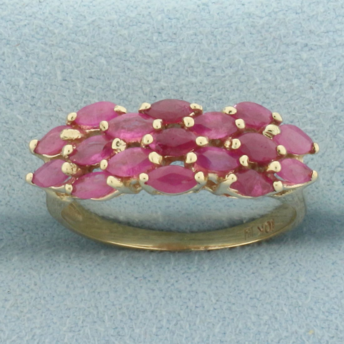 Natural Ruby Ring in 10k Yellow Gold: In 10k Yellow Gold. Contains seventeen 4x2mm high quality marquise cut natural Ruby gemstones, approximately 2ct TW, with bright color. 7.6mm wide at top of ring. Size 8. 3.6g.
