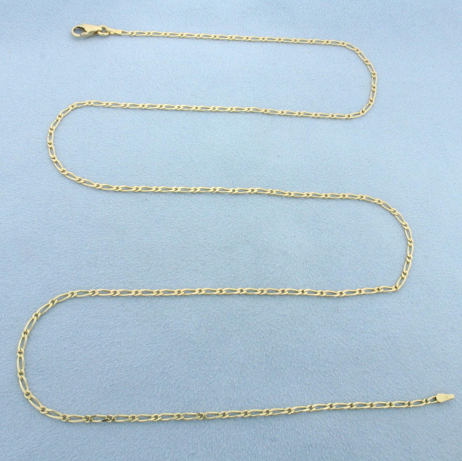 26 Inch Figaro Link Chain Necklace in 14k Yellow Gold: In 14k Yellow Gold. 26 inches long. 2mm wide. Lobster clasp. 6.8g.