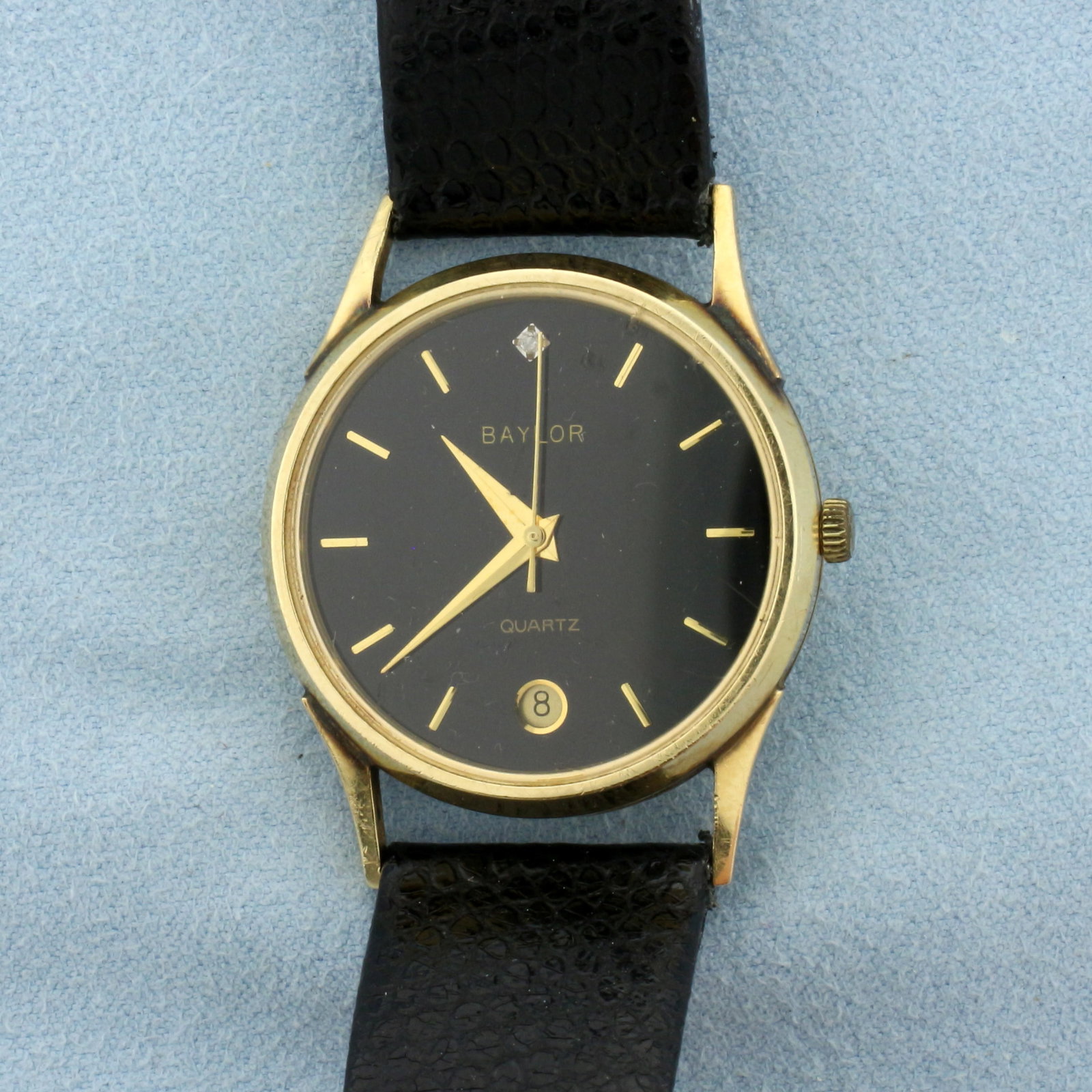 Vintage Mens Baylor Diamond Quartz Watch in Solid 14k Yellow Gold Case: Solid 14k Yellow Gold Case. Black leather strap. New battery, quartz movement runs great. Minor scratching on crystal, indicative of age. Diamond at 12:00. 23.5g.