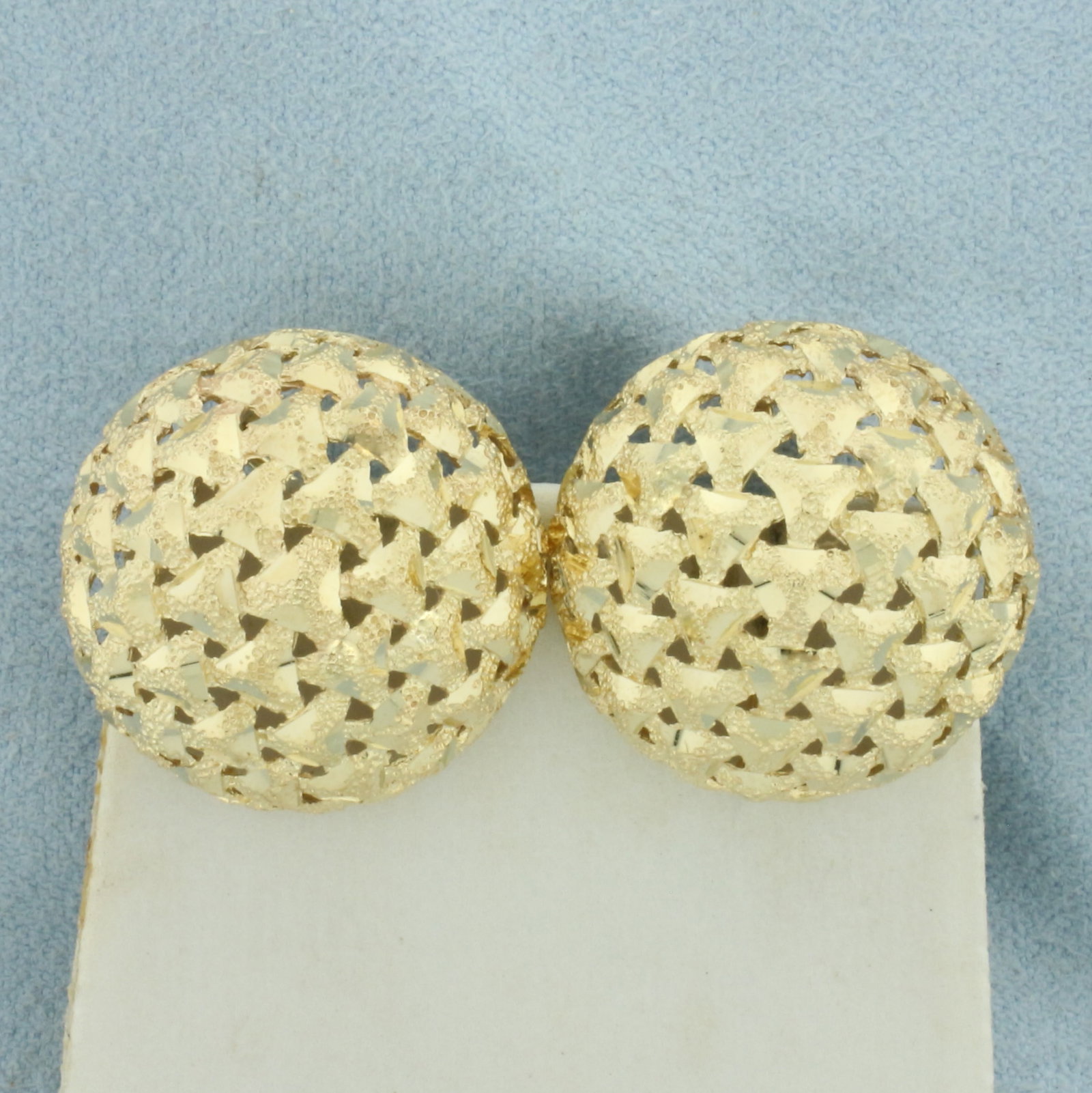 Diamond Cut Dome Button Earrings in 14k Yellow Gold: In 14k Yellow Gold. 22mm diameter. Woven design. For Pierced Ears. Omega backs. 8.7g.
