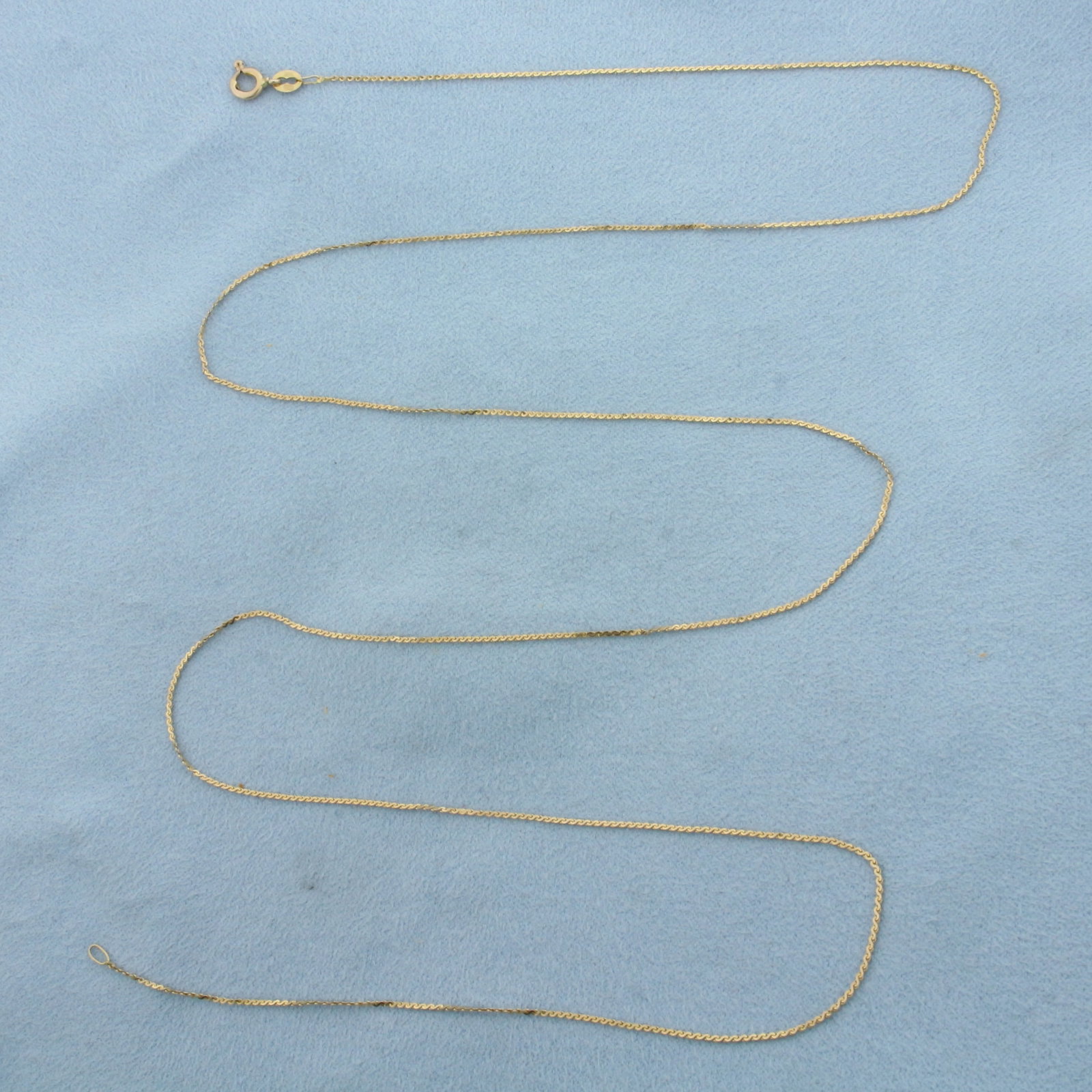27 Inch Italian S-Link Serpentine Chain Necklace in 14k Yellow Gold: In 14k Yellow Gold. 27 inches long. 0.85mm wide. Italian made. Spring clasp. 1.6g.
