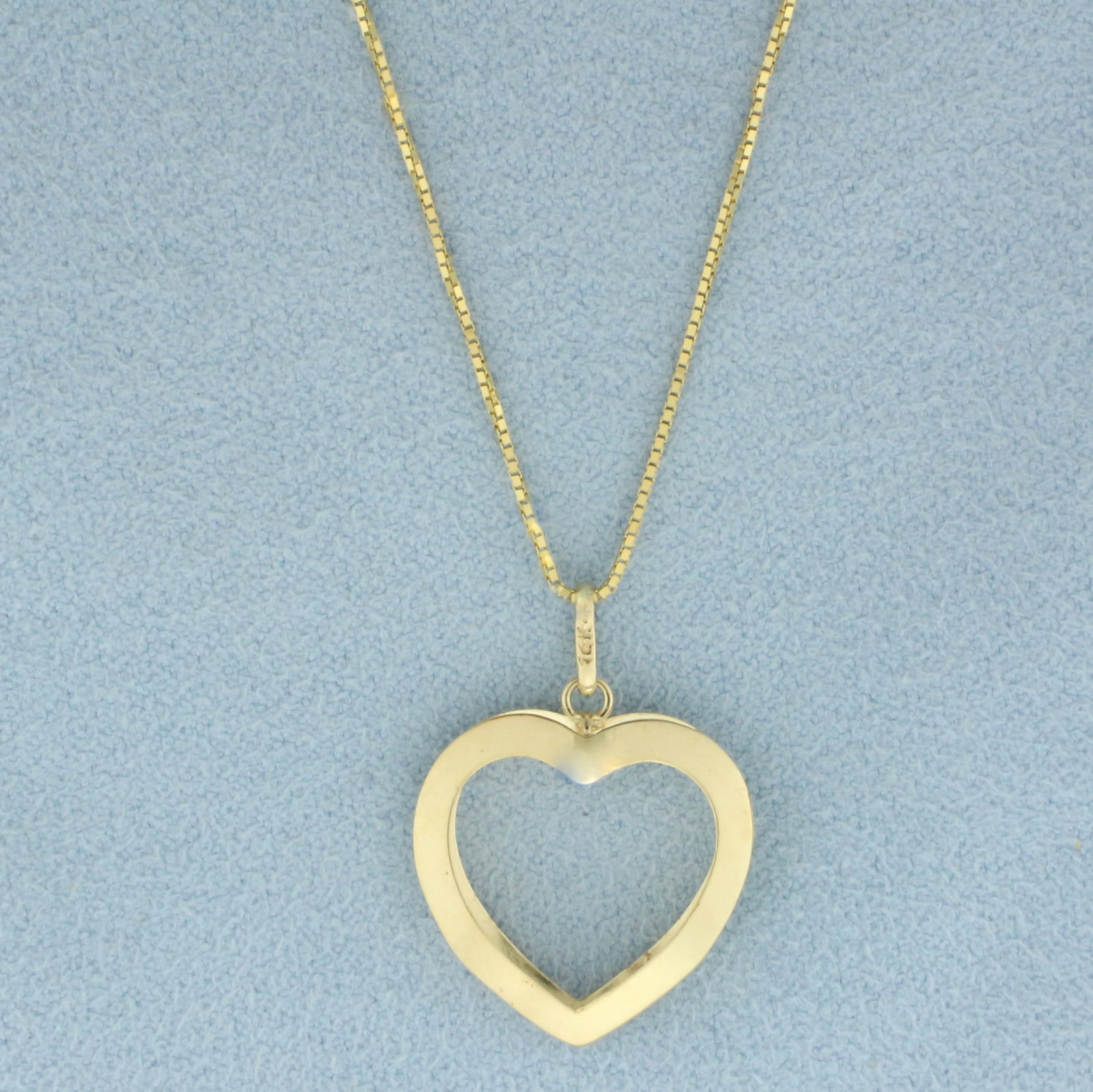 Modern Heart Necklace in 14k Yellow Gold: In 14k yellow gold. Box link chain is 18 inches long, .6mm thick, spring clasp. Pendant is 1 inch long (including bale) and 5/8 inches wide. 2.0g.