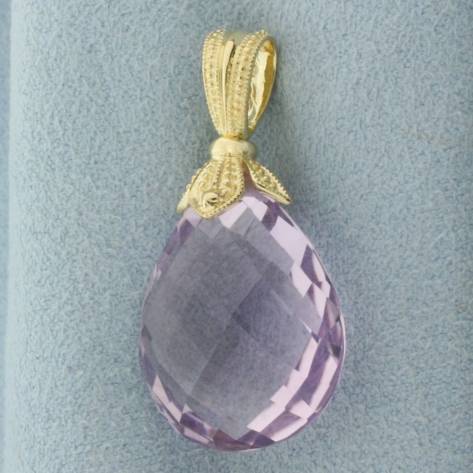 Checkerboard Cut Teardrop Amethyst Swivel Pendant in 14k Yellow Gold: In 14k Yellow Gold. Contains one high quality 23mm checkerboard cut natural Amethyst gemstone with vibrant color and excellent clarity. 1 1/4 inch long. 5/8 inch wide. Amethyst swivels for unique feat