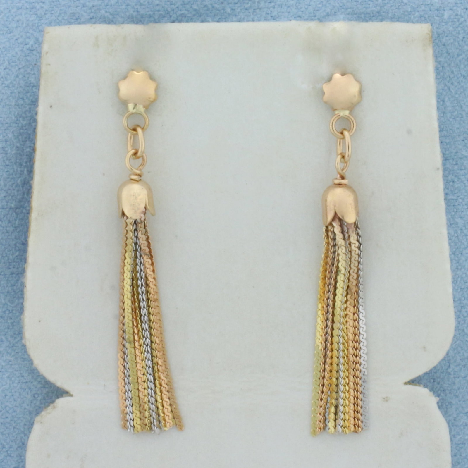 Tri-Color S-Link Chain Dangle Earrings in 14k Yellow, Rose, and White Gold: In 14k Yellow, Rose, and White Gold . 1 3/8 inch long. 1/8 inch wide at top. Friction backs. 2.5g.