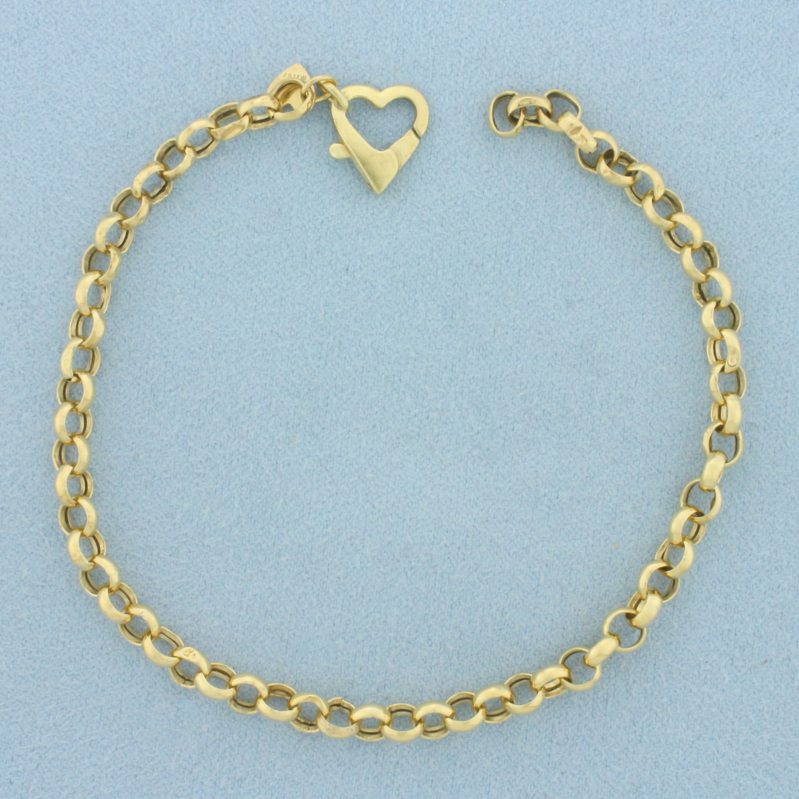 Italian Rolo Cable Link Bracelet in 18k Yellow Gold: In 18k Yellow Gold. 8 inches long. 4.0mm wide. Italian made. Heart lobster clasp. 4.1g.