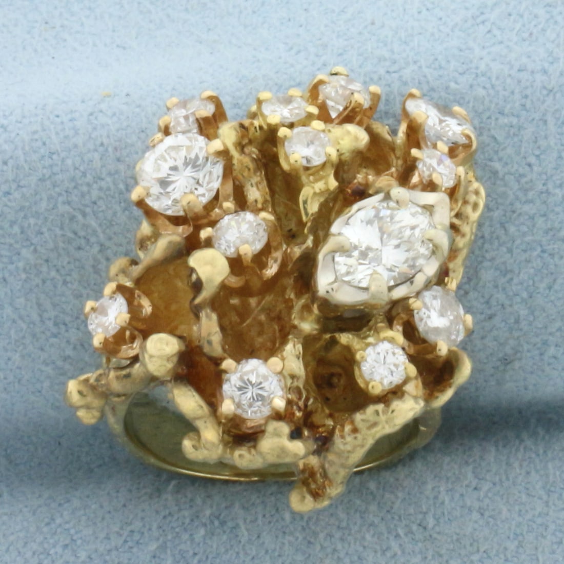 Diamond Nugget Statement Ring in 18k Yellow Gold: In 18k yellow gold. Contains One .25ct marquise, one round .25ct, one round .32ct, one round .09ct, one round .13ct, three round .06ct, and five round .05ct high quality diamonds, SI1 clarity, H color
