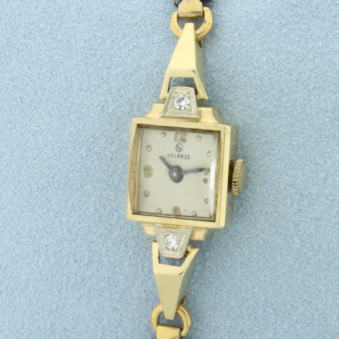 Antique Helbros Diamond Ladies Watch in 14k Yellow Gold Case: In 14k Yellow Gold Case. Gold plated bracelet. 17 jewel Swiss mechanical wind up movement runs great. Contains two high quality .05ct diamonds, VS clarity/G color. Model 81H. Serial number 197540. 15.