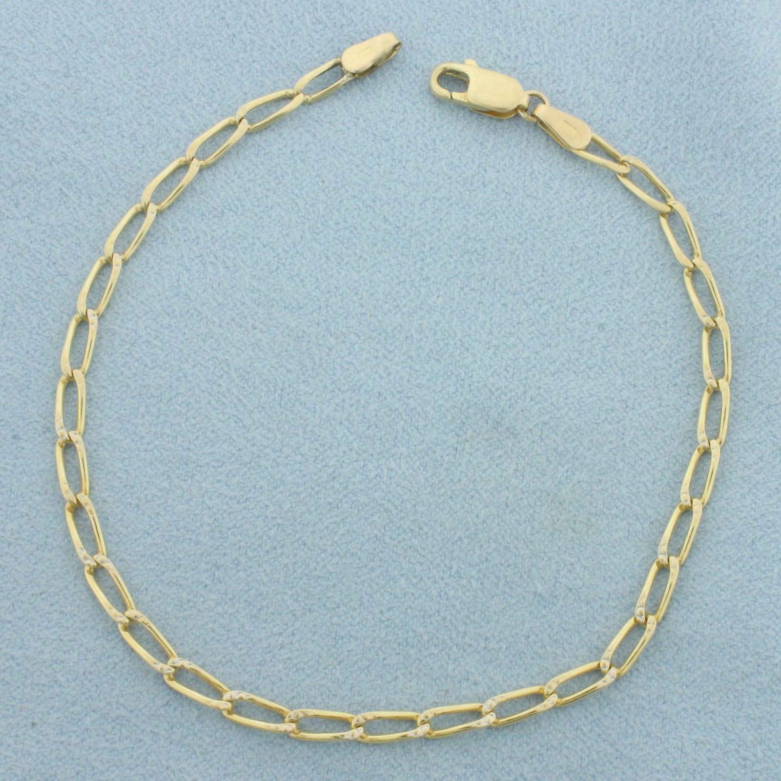 Oval Paperclip Link Bracelet in 14k Yellow Gold: In 14k Yellow Gold. 7 1/2 inches long. 3mm wide. Lobster clasp. 3.0g.