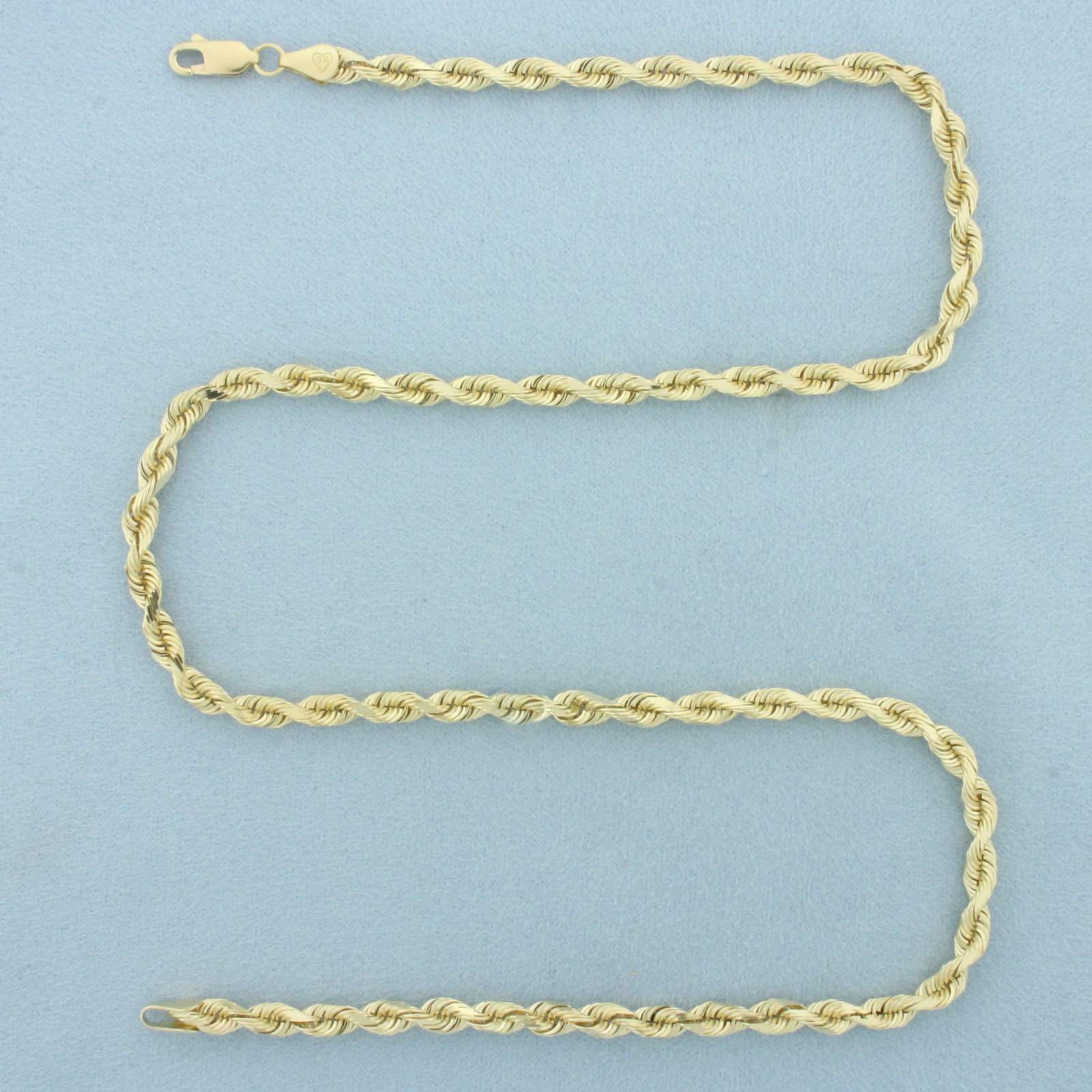 20 Inch Rope Link Chain Necklace in 14k Yellow Gold: In 14k Yellow Gold. 20 inches long. 4.6mm wide. Diamond cut for added brilliance. Lobster clasp. 23.9g.