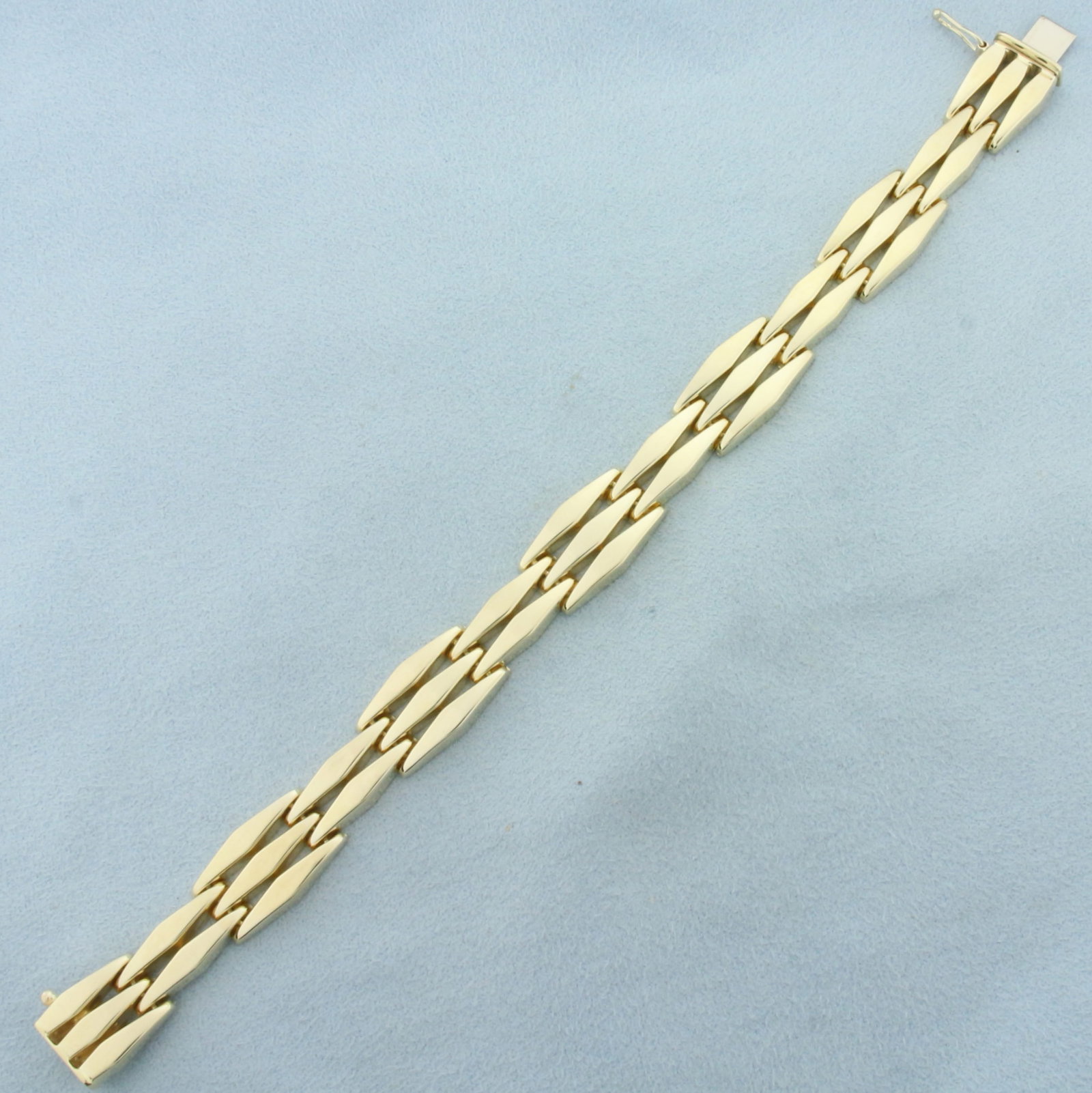 Italian Elongated Diamond Link Bracelet in 14k Yellow Gold: In 14k yellow gold. Italian made. 7 inches long, 3/8 inches wide. Concealed slide in clasp with safety latch. 16.3g.