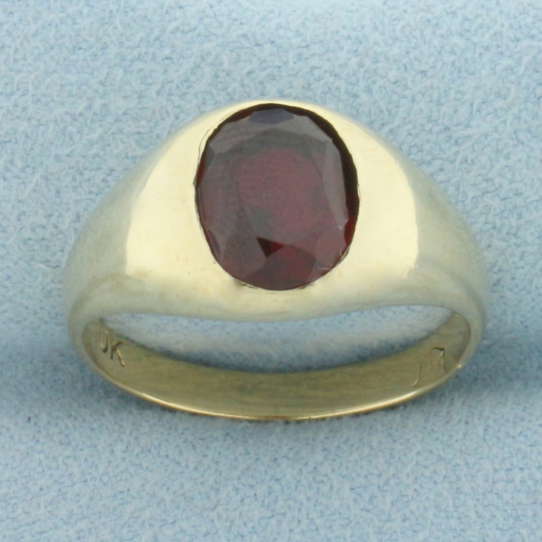 Mens Vintage Lab Ruby Ring in 10k Yellow Gold: In 10k Yellow Gold. Contains one high quality 10mmx8m, approximately 3ct, lab Ruby gemstone with intense color and excellent clarity. 11.3mm wide at top. Size 10. 5.9g.